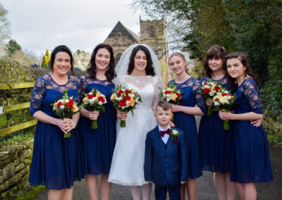 Bride and bridesmaids sharing a laugh in Derbyshire