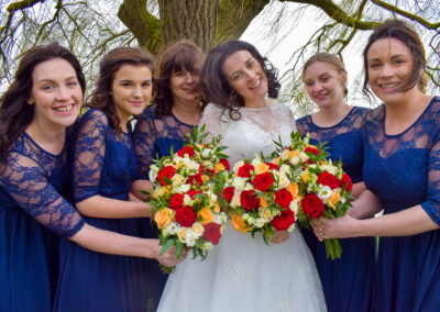 Bride and bridesmaids grant pose