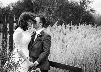 Happy newlyweds stroll through the streets of Derbyshire