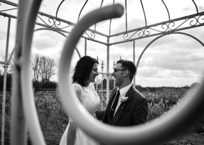 Bride and groom share a loving glance in London