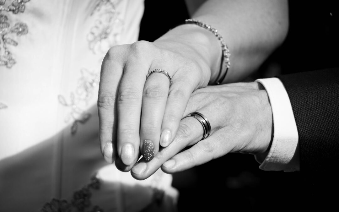 Bride and groom's hands with their wedding rings in close-up